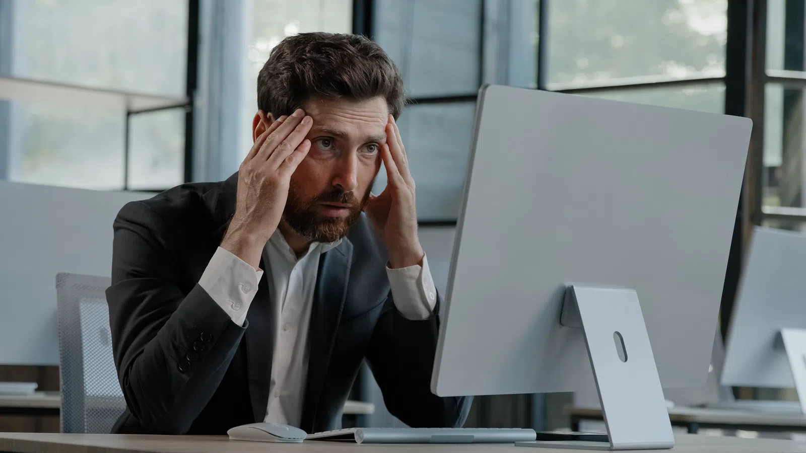 a man holding his head