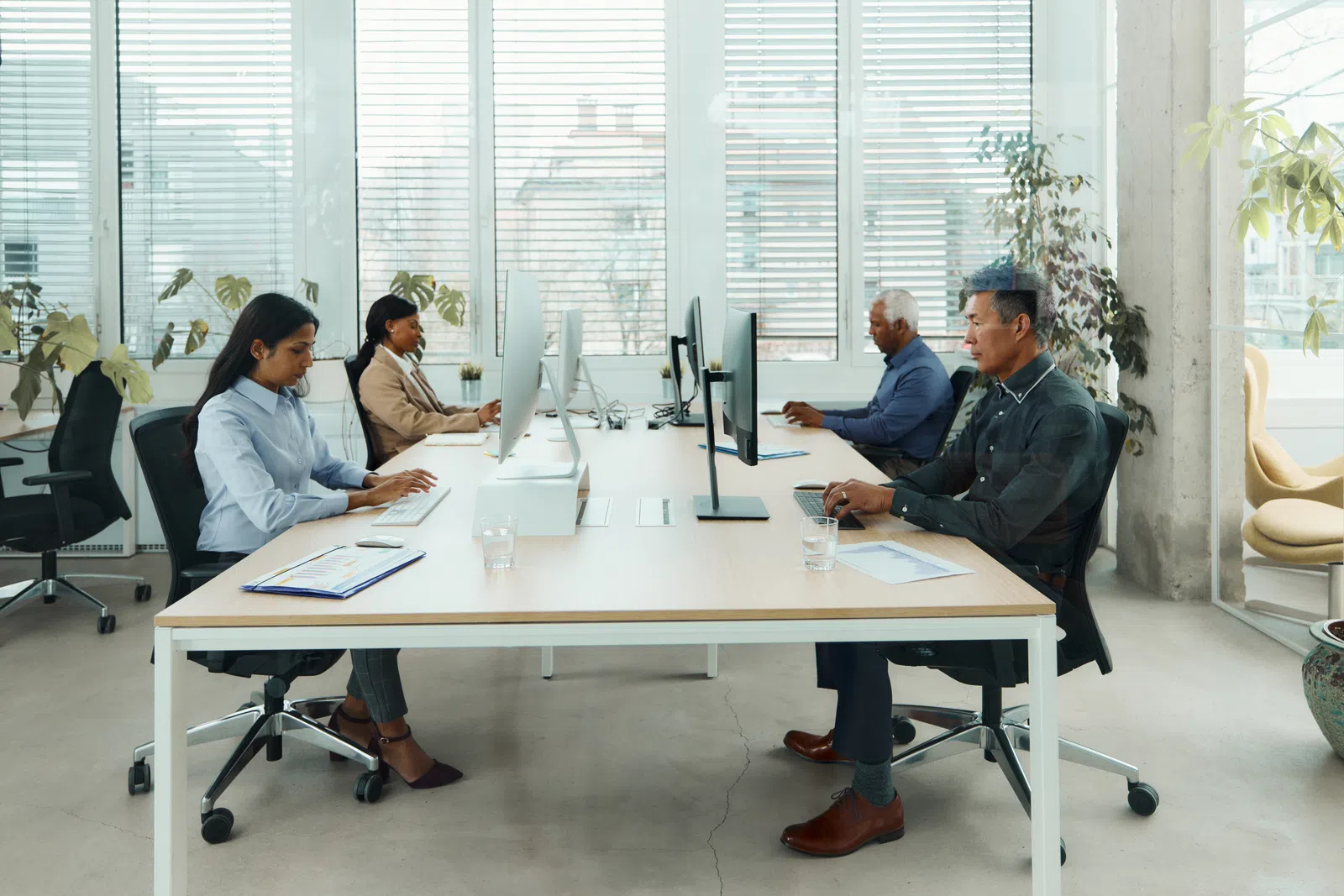 a group of people sitting around a table